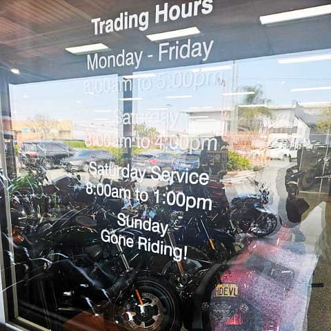 Cut Vinyl glass graphics for open hours, installed to the door at Gaoline Alley