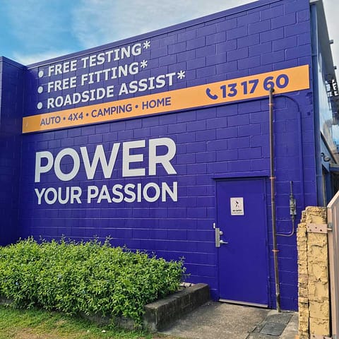 Building signage similar to the latest Battery World updates to catch store fronts up to their new corporate branding use metal signage like ACM cutout letters to really spell out a message that will last for ages!