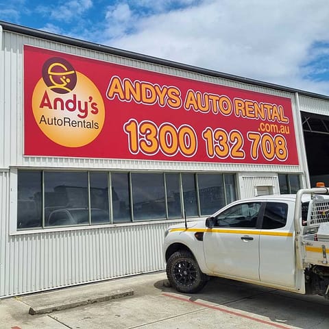 Andy's Auto banner for building facade offers vibrant printed colour across a massive area without joins, easy to put up and remove and will last for a long time