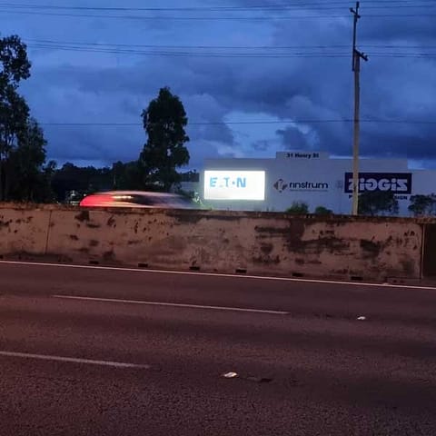 Illuminated sign with flex face banner for Eaton (highway night time)