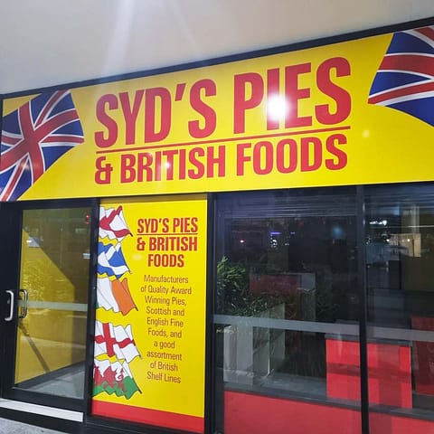 Vinyl graphics applied to door and window glazing for Syd's Pies