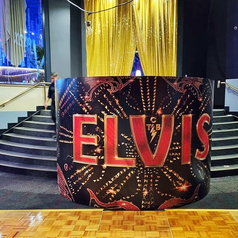 Elvis movie premiere - promotional wallpaper and ticket booth wrapped with vibrant printed vinyl