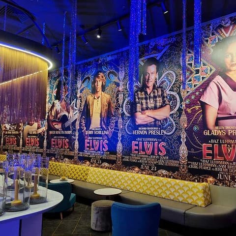 Elvis movie premiere - promotional wallpaper and ticket booth wrapped with vibrant printed vinyl