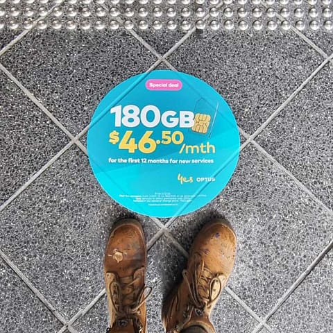 Floor stickers and decals for promotion of Optus in-center - print and installation by Ziggi's Print & Signs